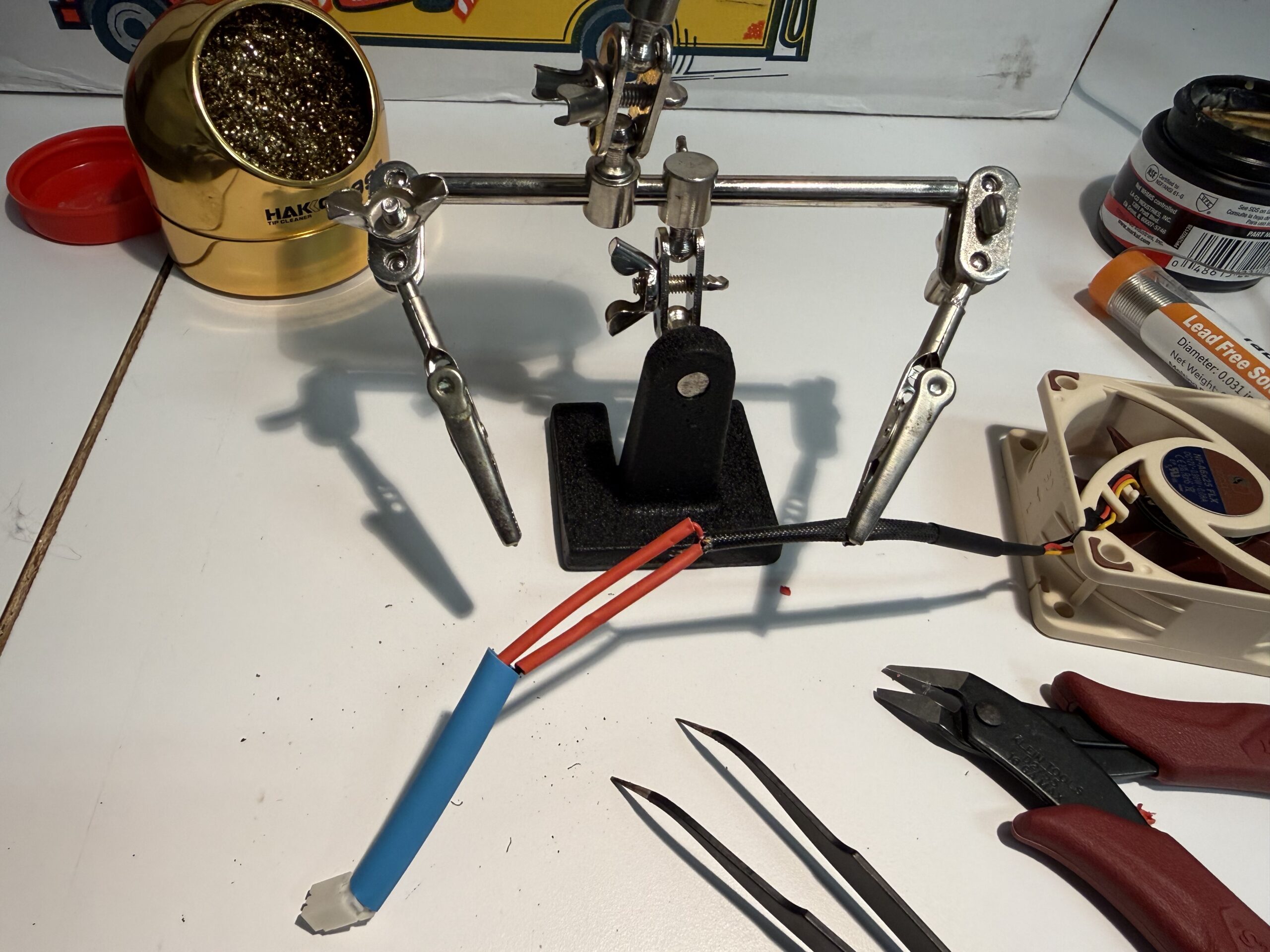 Close-up of wire splice with red and black leads